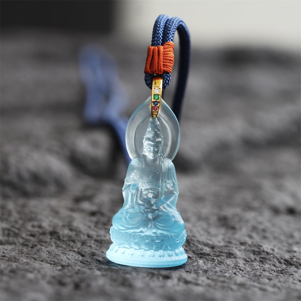 The Serene Listener: Handcrafted Translucent Liuli Seated Guanyin Amulet