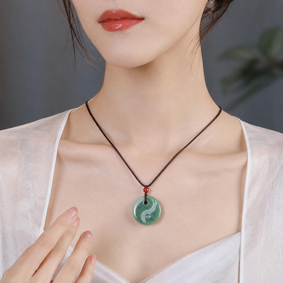 The Flow of Harmony: Jadeite Tai Chi Safe Knot Pendant